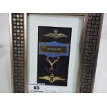 Three framed R.A.F. wings and badges to