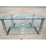 A glass three tier TV unit approx 53cm x