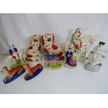 Nine Staffordshire pottery figurines the