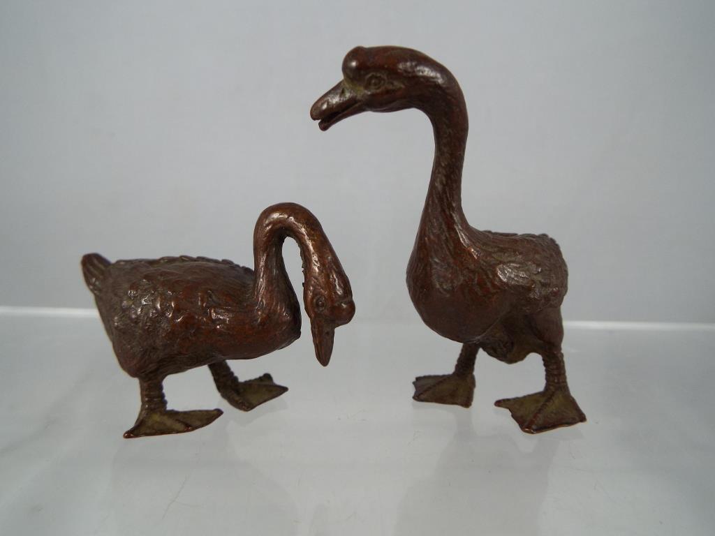 A pair of bronze geese, Est £30 - £50.