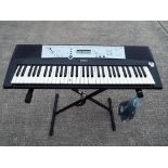 Yamaha - a Yamaha keyboard with stand and charger, model No.