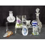 Lalique - A quantity of glassware to include paperweights, decanter and a Lalique bottle form vase,