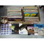 Two boxes of 33 rpm vinyl records to include Fleetwod Mac, Pink Floyd, Kate Bush,