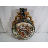 A very large impressive Chinese vase decorated with figures in a garden scene, twin dragon handles,