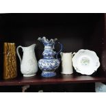 An Oriental style blue and white water jug,