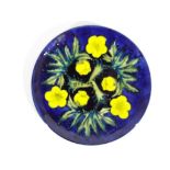 Moorcroft - A Moorcroft pottery 1990 year plate, decorated in the Buttercup pattern,