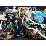 A large box containing a very large quantity of costume jewellery to include bangles, rings,