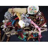 A box containing a large quantity of costume jewellery to include beaded necklaces,