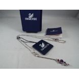 Swarovski - a Swarovski crystal necklace and pendant bearing logos, in original box,