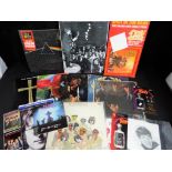 A lot to include two 33 rpm vinyl records by the Rolling Stones, comprising Rolling Stones #2,