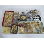 A good mixed lot of costume jewellery to include paired earrings, necklaces, brooches, bracelets,