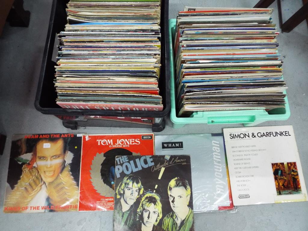 A large quantity of 33 rpm vinyl records to include Tom Jones, Adam and The Ants, Wham,