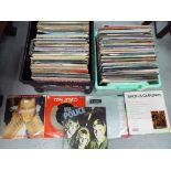 A large quantity of 33 rpm vinyl records to include Tom Jones, Adam and The Ants, Wham,