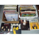 A large quantity of 33 1/3 rpm vinyl records to include Shakin' Stevens, Elvis, Black Sabath, Queen,