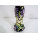 Moorcroft - a Moorcroft Pottery vase decorated with purple flowers impressed marks to the base