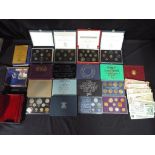 A lot to include five United Kingdom Royal Mint proof coin collection sets,