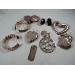 A collection of silver items comprising earrings, pendants and similar, hallmarked or stamped 925,