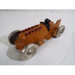 A cast metal model of a racing car.