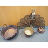 A mixed lot of metal ware to include copper and brass pans and a brass peacock tail hearth fan.