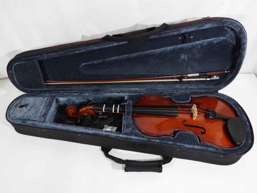 An Allieri VL144 full size violin with bow contained in protective case, violin body length 35.