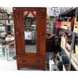 A good quality art nouveau wardrobe with mirrored door and one drawer,