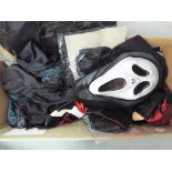A lot to include a quantity of Halloween costumes, wigs, hats, masks and similar.
