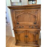 Andrena furniture - a carved light oak wine cabinet # 840,