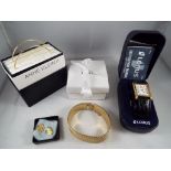 A good mixed lot to include two yellow metal unmarked Anne Klein II yellow metal bangles,