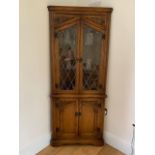 Andrena furniture - a carved light oak corner cabinet # 322L/L,