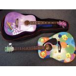 Two acoustic guitars comprising a Disney by Washburn and a Yamaha FG-401.