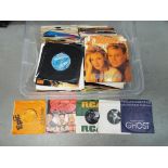 A quantity of 45 RPM vinyl records to include The Righteous Brothers, Ringo Starr, Cliff Richard,