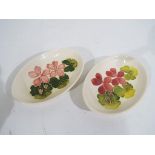 Moorcroft - a pair of Moorcroft pottery oval pin dishes,