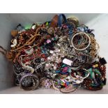 Large quantity of unsorted costume jewellery, wrist watches and similar,
