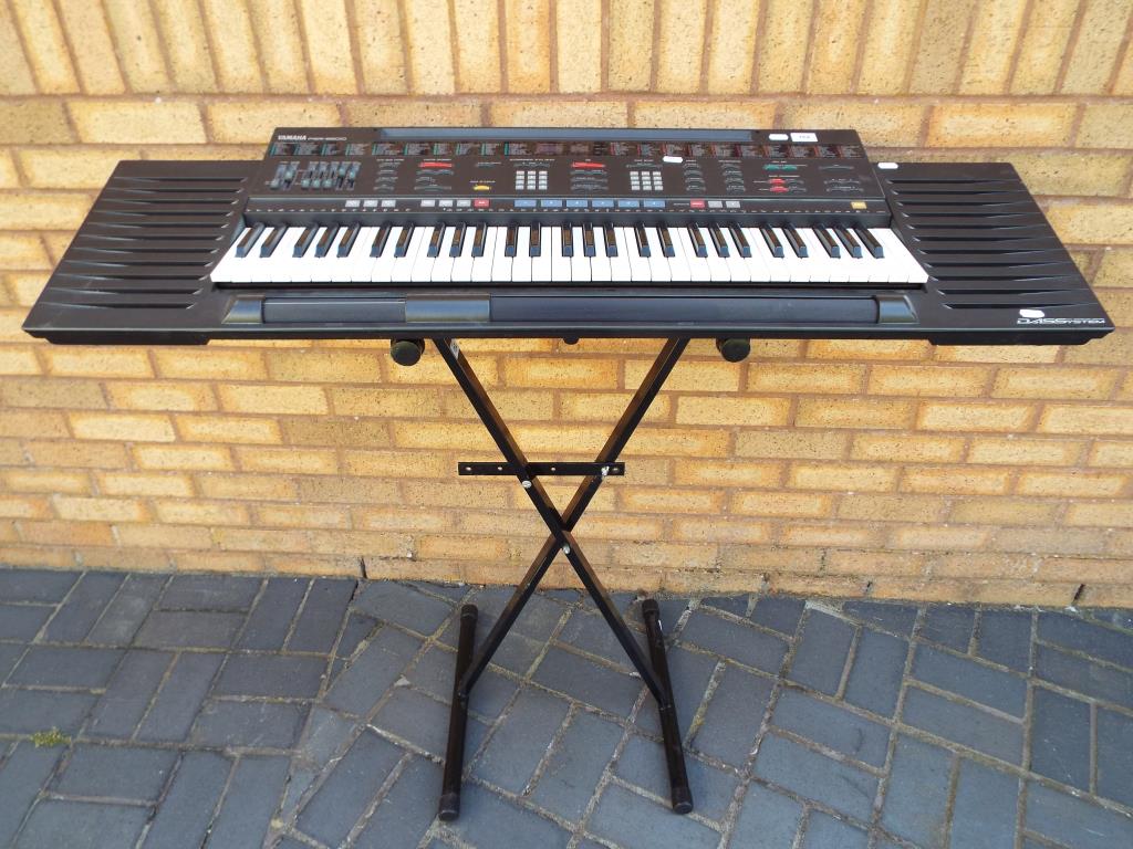 Yamaha PCR-3500 electronic keyboard with stand and a box of sheet music [3].