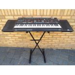 Yamaha PCR-3500 electronic keyboard with stand and a box of sheet music [3].