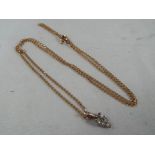 A lady's unmarked diamond cut curb chain, tested as gold,