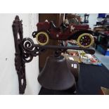 A wall mounted cast iron bell with motor car decoration - Est £15 - £30