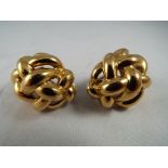 A pair of lady's 18ct gold earrings with flip back safety clasp stamped 750, approx weight 23.
