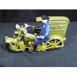 A novelty cast iron Postman's motorcycle Est £15 - £25 This lot MUST be paid for and collected,
