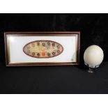 A framed Royal Canadian Mint Millennium Coin collection and ostrich egg on stand [2]