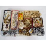 A good mixed lot of predominantly vintage costume jewellery to include pearls, brooches, necklaces,