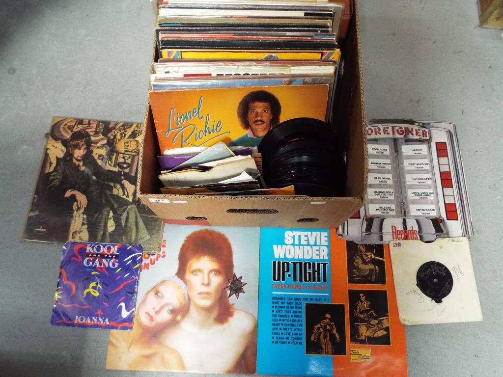 A quantity of 33 and 45 rpm vinyl records to include BB King, David Bowie,