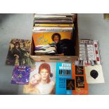 A quantity of 33 and 45 rpm vinyl records to include BB King, David Bowie,