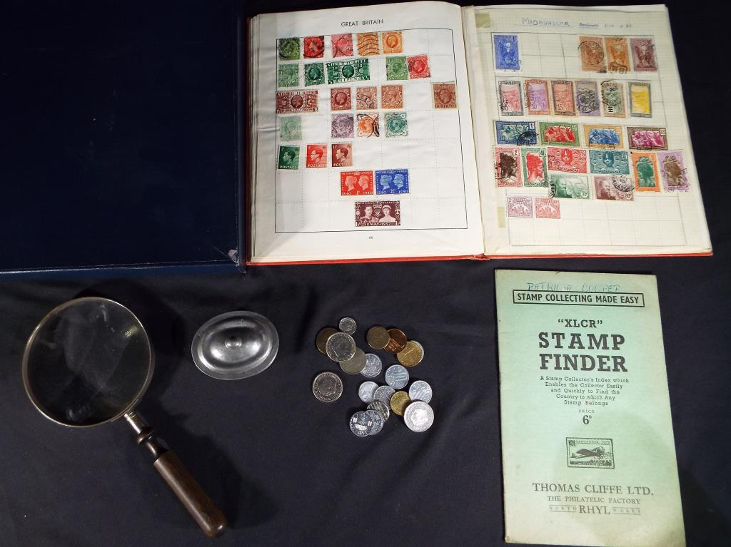 A lot to include two stamps albums one containing a quantity of UK and Foreign stamps,