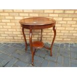 A mahogany occasional table with lower gallery