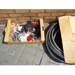 A quantity of cycling related accessories, including tires, chains, inner tubes,