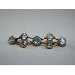 9 carat - a 9ct gold multiple stone set bar brooch stamped 9ct to the bar, approx weight 3.