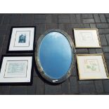 An oval framed bevel edged wall mirror approximately 86 cm x 61 cm,