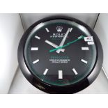 An advertising wall clock (unused) This lot must be paid for and collected (or despatched) no