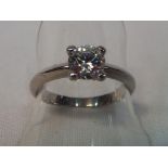 A white metal solitaire stone set ring size Q